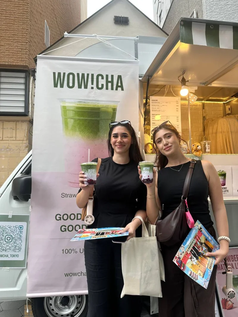 Tourists enjoying Asakusa matcha drinks at WOW!CHA kitchen car Tokyo