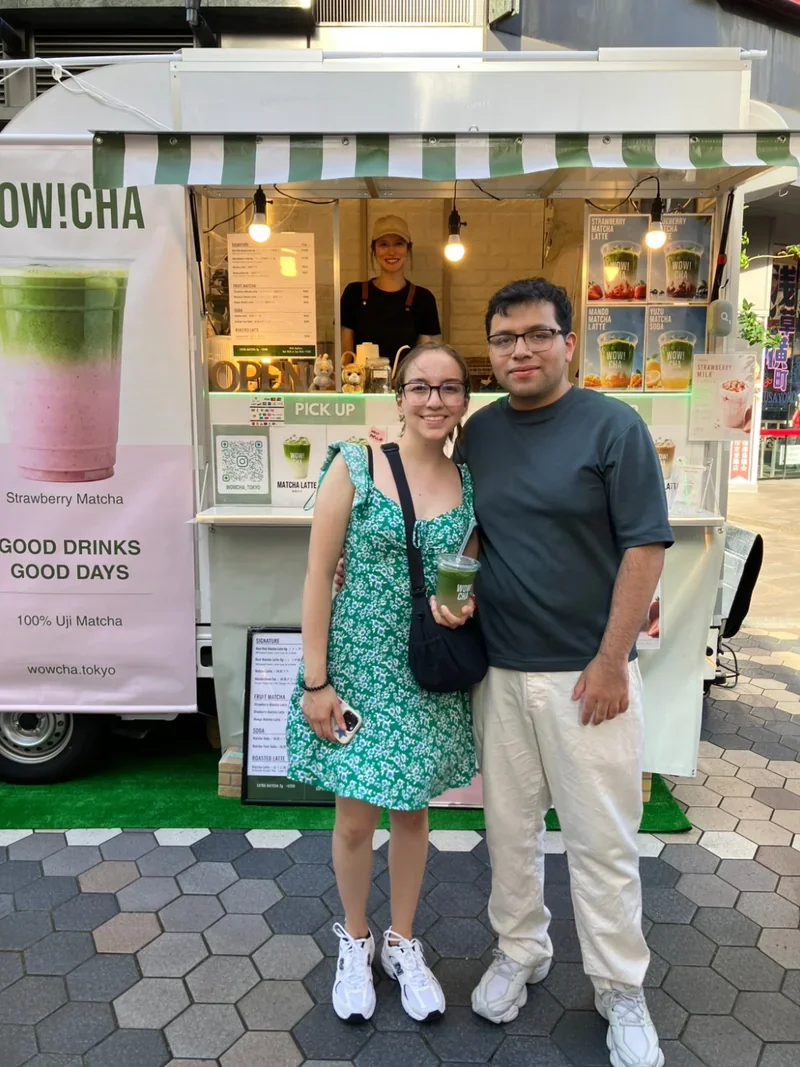 Couple posing with matcha drinks at WOW!CHA kitchen car, Asakusa Tokyo